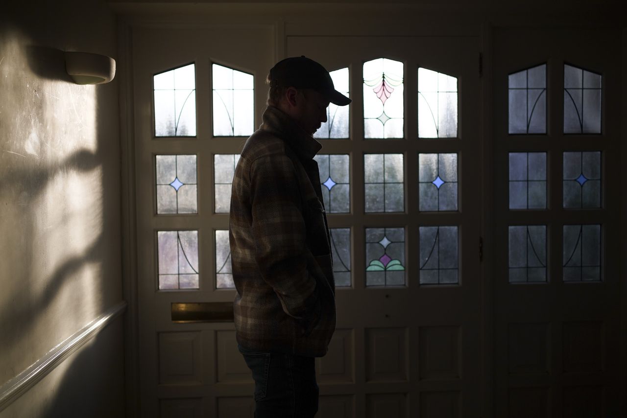 Silhouette of person standing in front of a glass door, taken with the Sigma BF camera and Sigma 35mm F2 DG lens