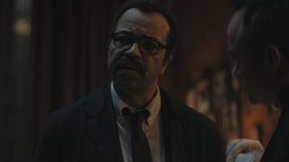 Gordon talking to Batman at a crime scene