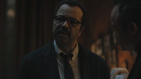 Gordon talking to Batman at a crime scene