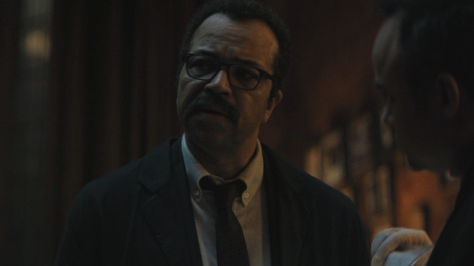 Gordon talking to Batman at a crime scene
