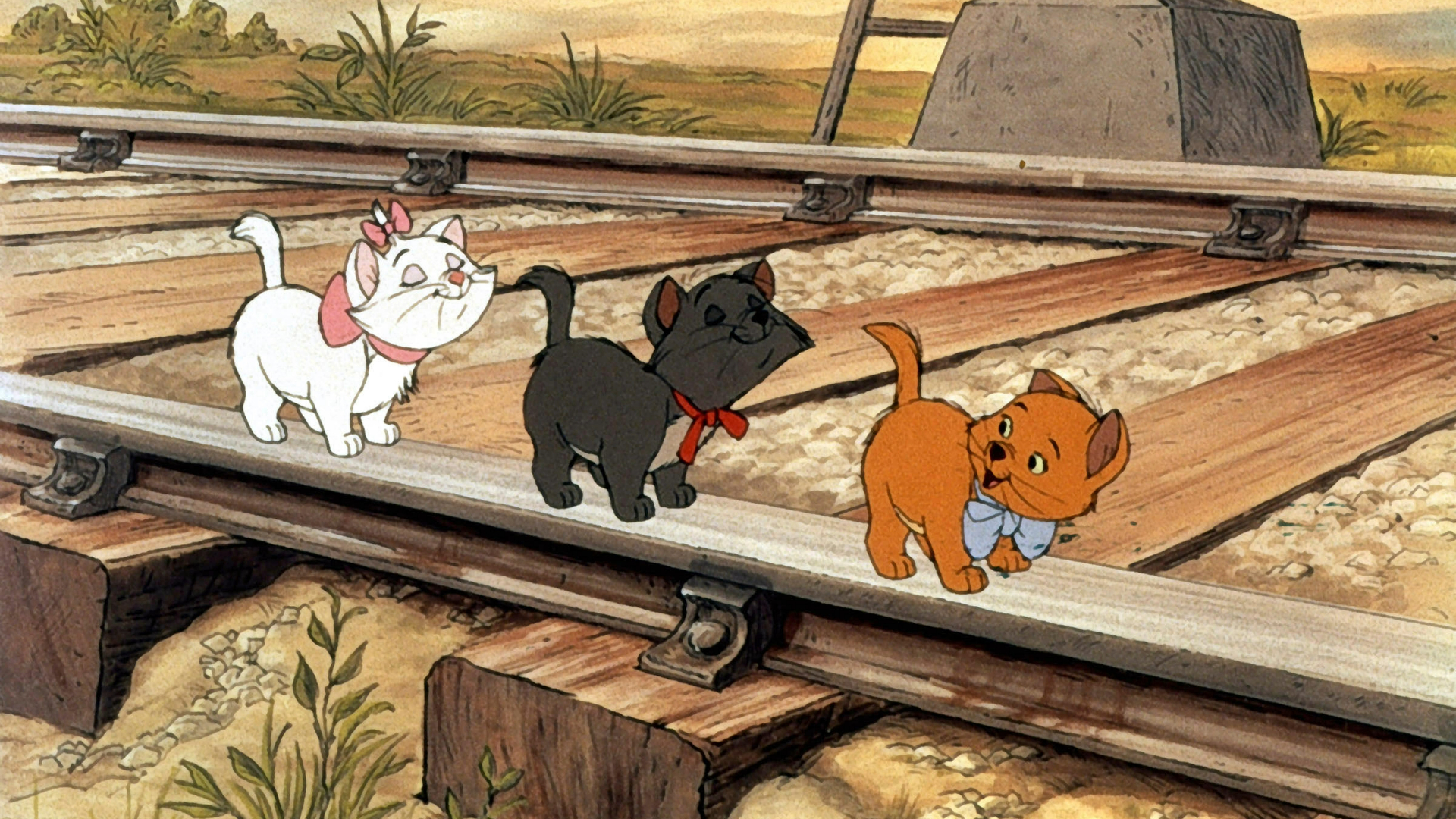 The three Aristocats walking along a train track