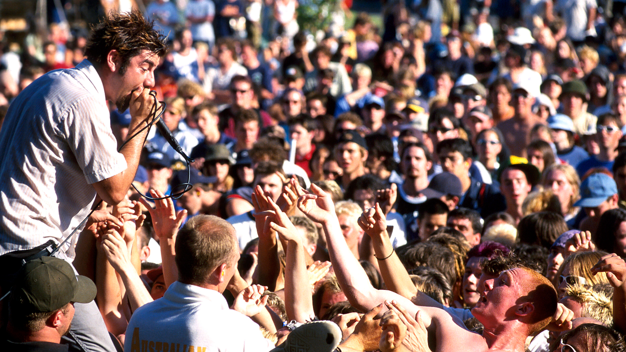 Chino Moreno over a crowd in 1999