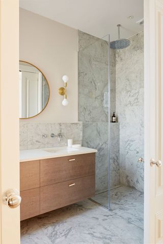 A shower with a storage ledge for toiletries