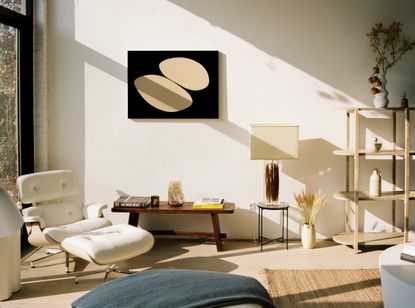 A Japandi style interior with a white Eames chair and a neutral color palette