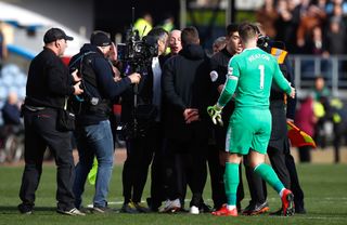 Mauricio Pochettino confronted referee Mike Dean after the Burnley defeat