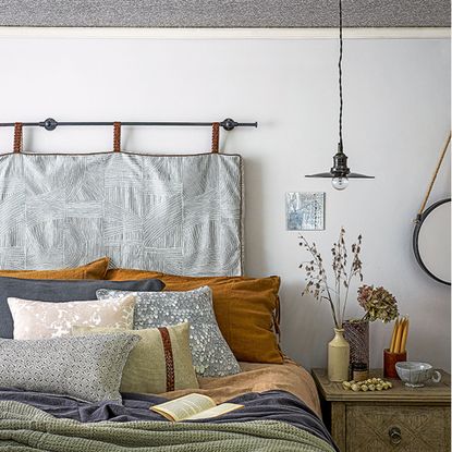 White bedroom with hanging headboard