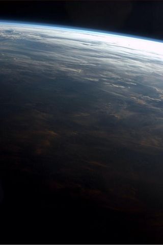 Pink Clouds at Sunset From ISS