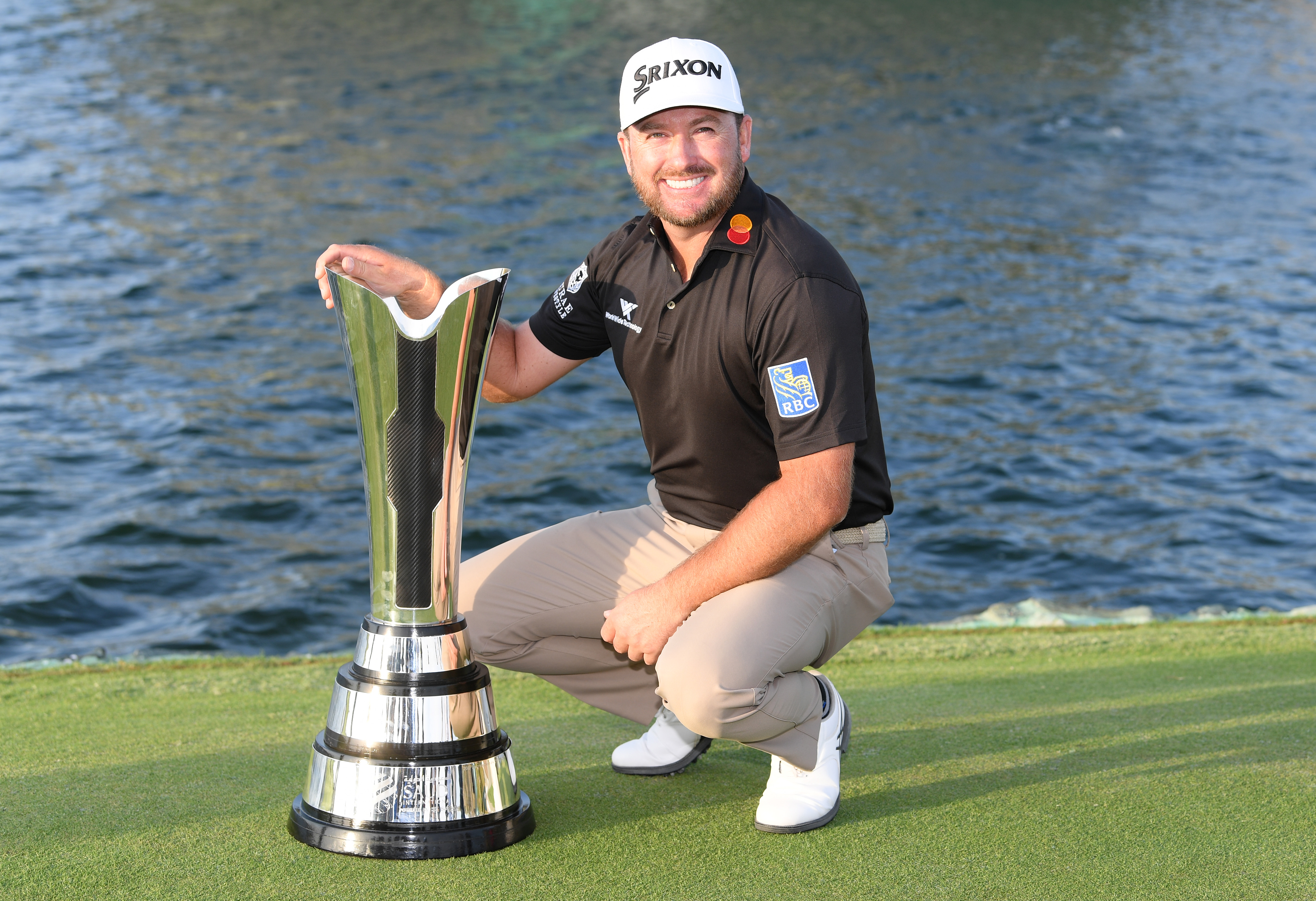 Graeme McDowell poses with a trophy
