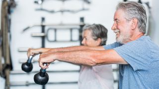 Seniors workout their muscles with kettlebells
