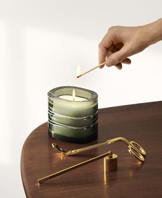 Hand lights Diptyque refillable candle
