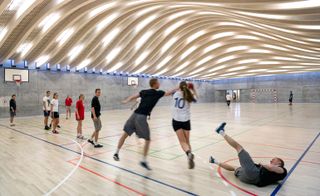 The glulam arches of the sports hall, which was the first stage in the development