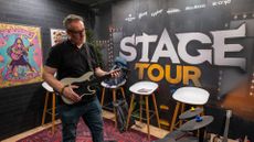 Stage Tour &ndash; Rik Henderson plays the game on a CRKD guitar controller