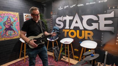 Stage Tour &ndash; Rik Henderson plays the game on a CRKD guitar controller