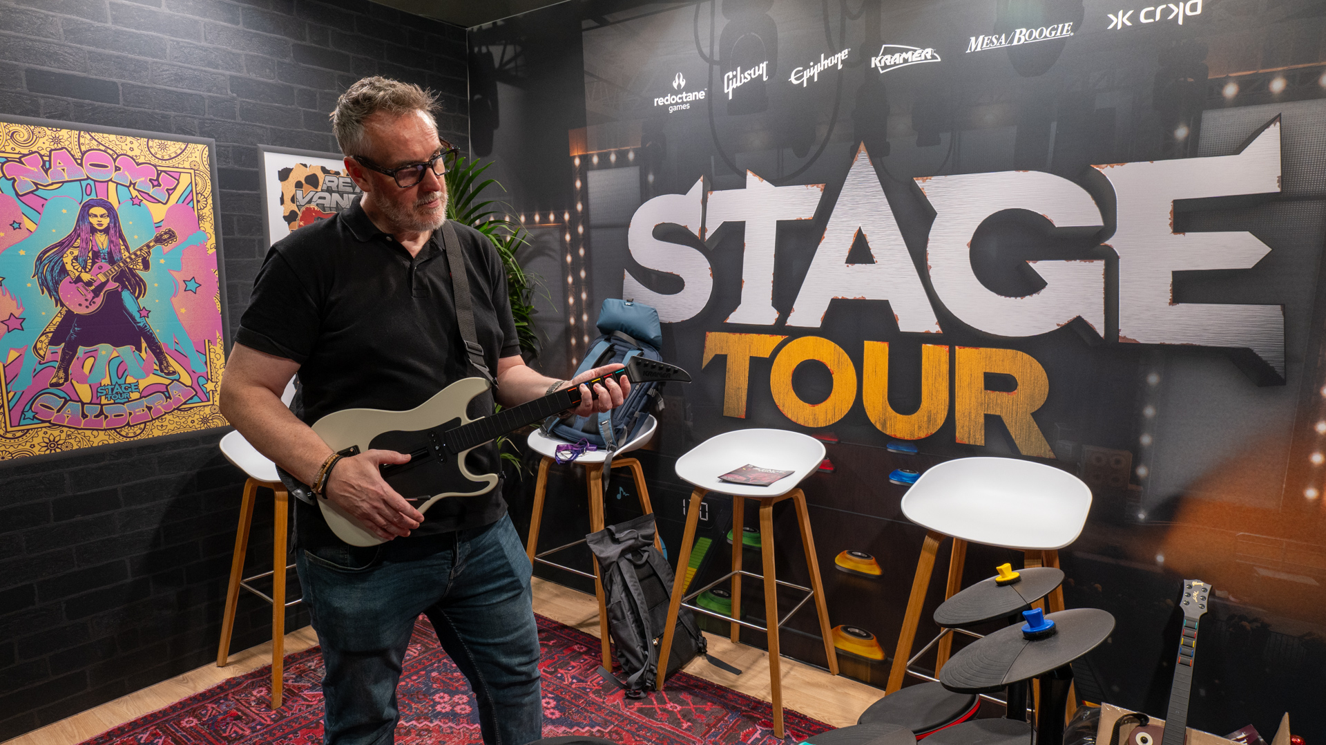 Stage Tour &ndash; Rik Henderson plays the game on a CRKD guitar controller