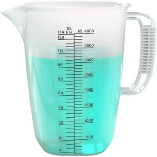  large cloudy plastic measuring jug with a black scale printed on the side. A light blue liquid inside, filled to the 3100ml line