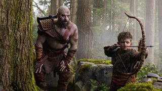 Ryan Hurst's Kratos crouching near Atreus (Callum Vinson) in first look at God of War series