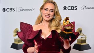 The singer Adele accepting a Grammy award.