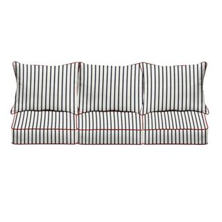 navy and white striped outdoor seat cushion for three-seater sofa with red trim