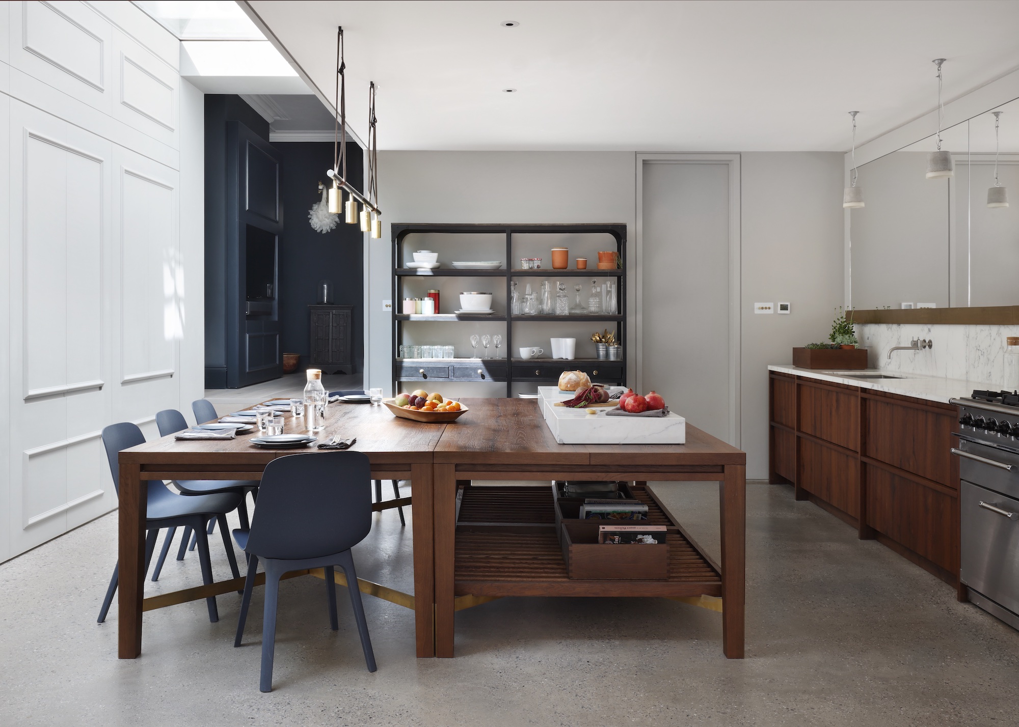Kitchen with large table and skylights and mirrored walls