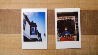 Images from the Fujifilm Instax Mini SE sit on a table