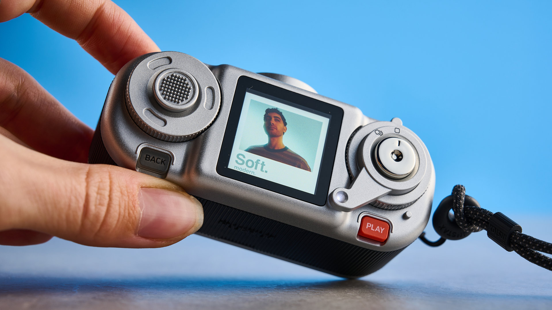 A black and silver Fujifilm Instax Pal 2 digital camera