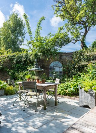 Garden designer Nic Howard used his creative skills to turn a compact courtyard into a haven bursting with colour and interest