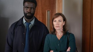 Jordan Kouamé in a dark jacket as Dr George Adjei and Helen Behan in a green top as Dr Norma Callahan in Malpractice.