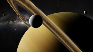 Saturn moon Enceladus in front of planet Saturn, rings and other moons.