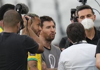 Lionel Messi with Brazil’s Neymar, left, and Argentina coach Lionel Scaloni