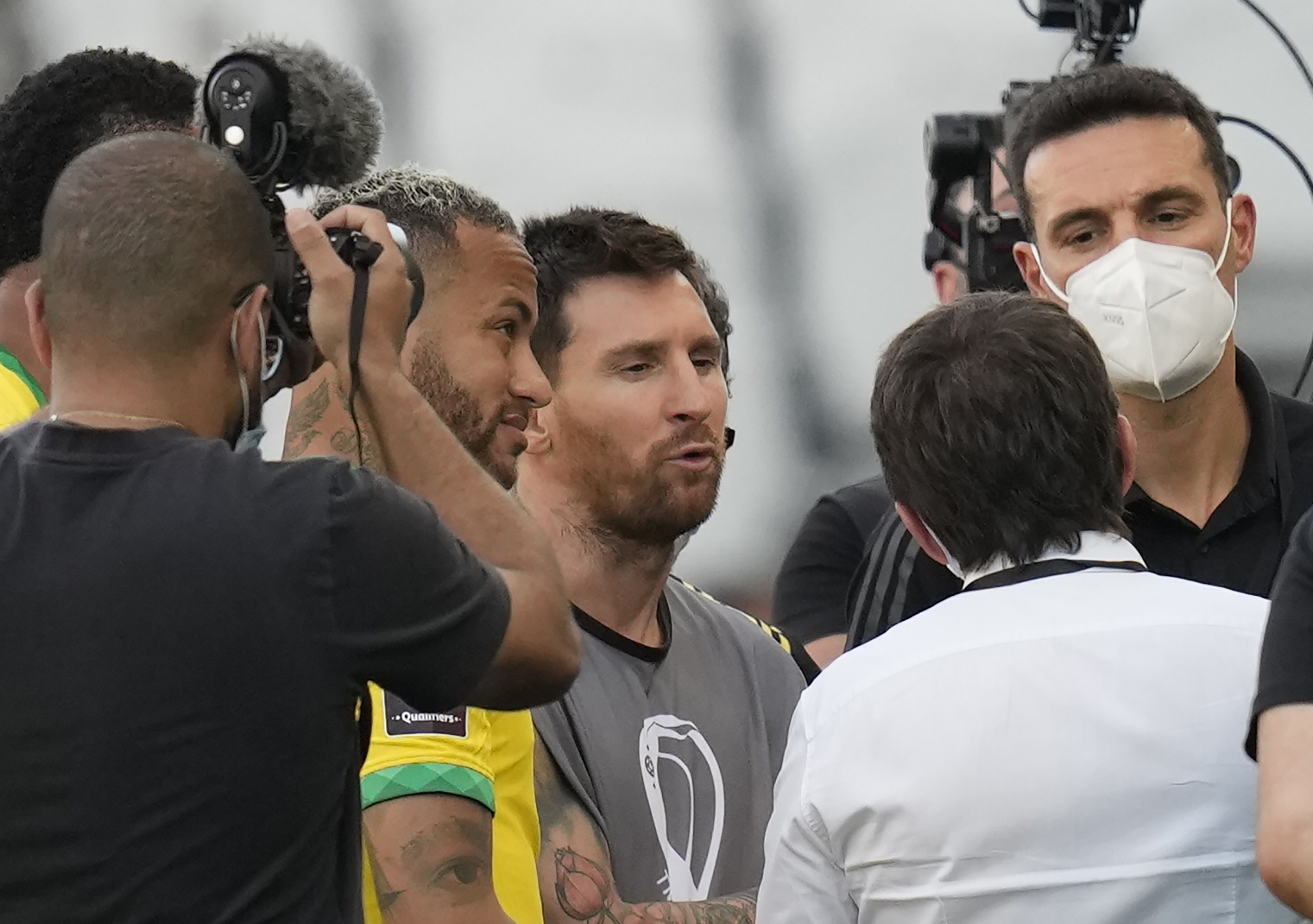 Lionel Messi with Brazil’s Neymar, left, and Argentina coach Lionel Scaloni