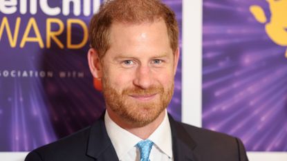 Prince Harry wearing a suit and tie smiling at the WellChild Awards 2024