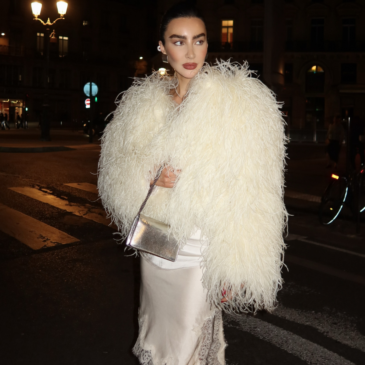 An image of a woman wearing polished holiday wardrobe items 2026