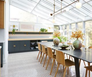 Solarium kitchen with a slanted roof and dark blue cabinetry