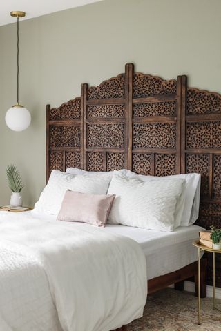 A room divider used as a headboard