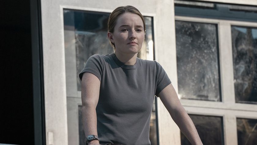 Abby standing outside looking at WLF's stadium camp in The Last of Us Season 2 finale