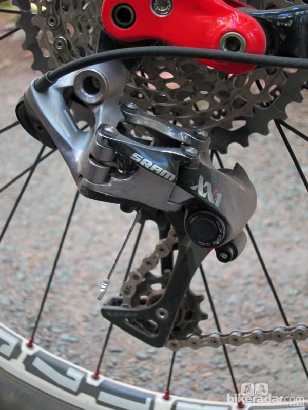 The new SRAM XX1 rear derailleur uses what the company calls a 'straight P' geometry with no slant to the parallelogram. According to SRAM, this results in fewer ghost shifts in bumpy terrain. Proper chain gap is ensured by the massively offset upper pulley.