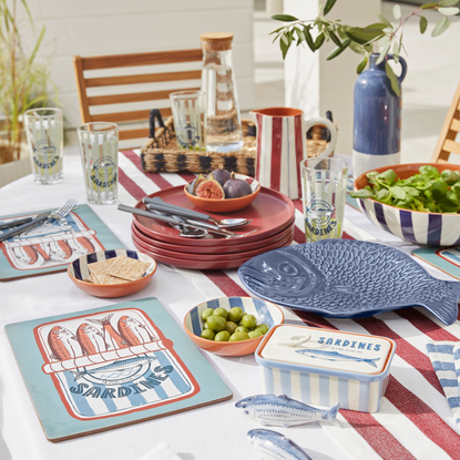 striped and fish-themed tableware on a table.
