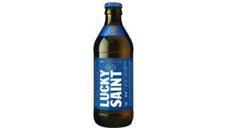 A brown bottle with blue label saying Lucky Saint Unfiltered Lager