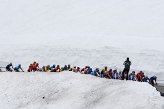 A general view of the peloton climbing to the snowy Campo Imperatore the Giro dItalia 2023 Stage 7 
