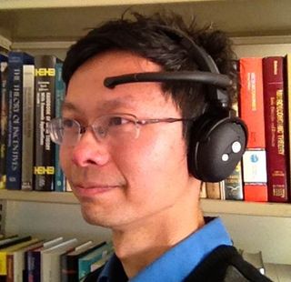 Professor John Chuang models the NeuroSky MindWave brainwave sensor.