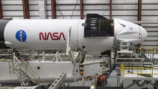 SpaceX's Crew Dragon and Falcon 9 rocket are pictured in the hangar at Launch Complex 39A, at NASA's Kennedy Space Center in Florida, ahead of the planned launch of the Crew-1 mission to the International Space Station.