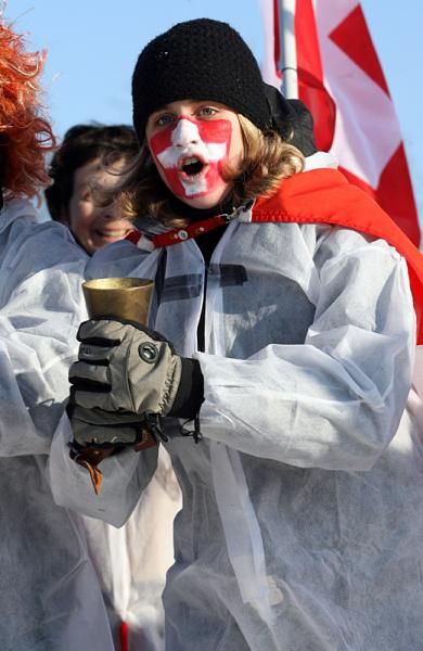 A Swiss fan cheers on Christian Heule, who had a spectacular race.