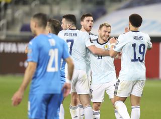 Ryan Fraser, second right, earned Scotland a point in Israel
