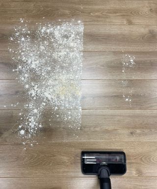 Miele Duoflex vacuuming flour and sugar on wooden floor in Future test center