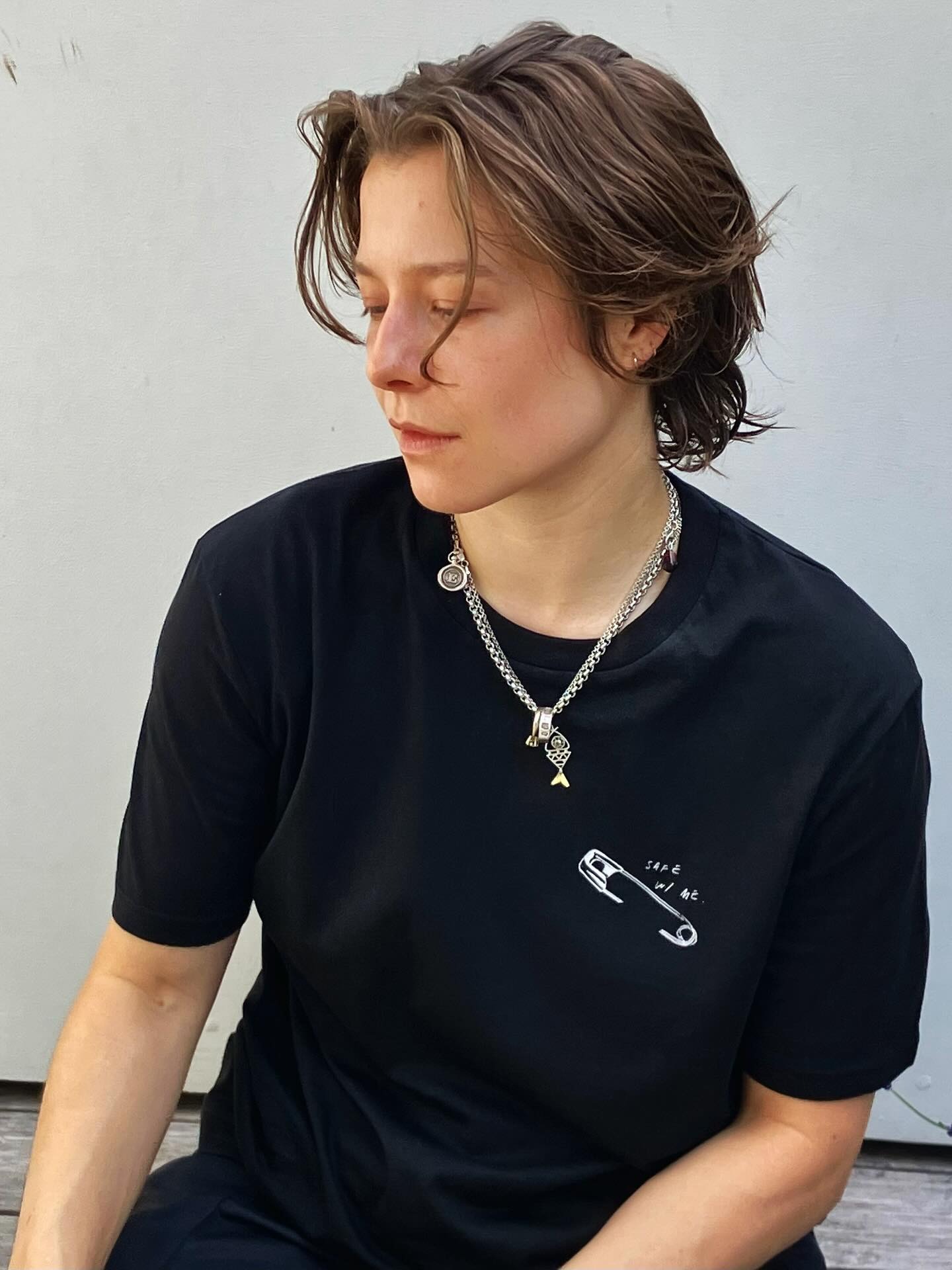 Image of Emma D’Arcy wearing a textured, cropped hairstyle.