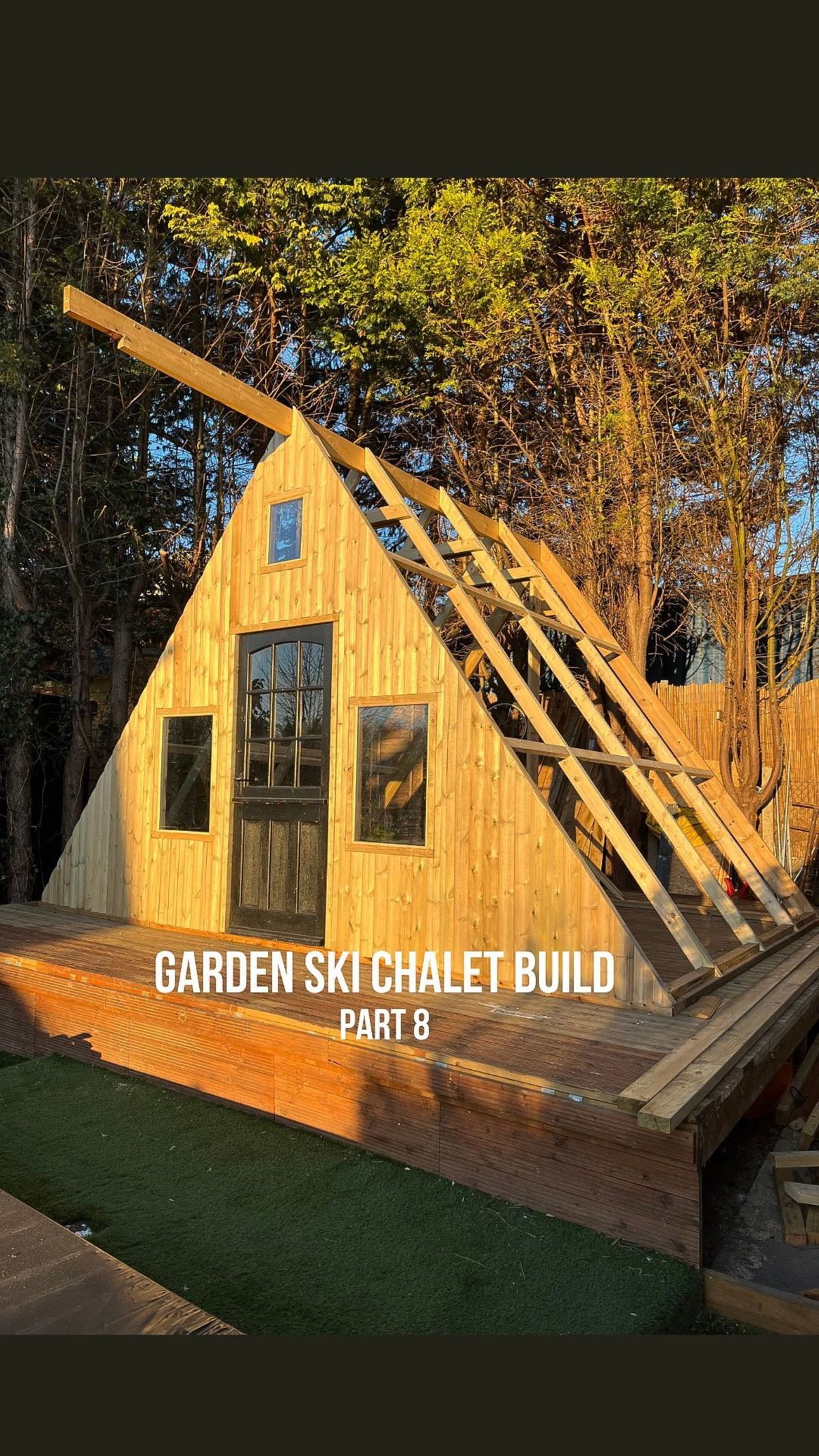 The wooden shell of the shed with window holes installed