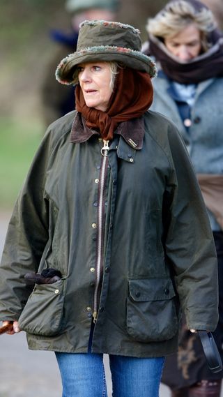 Queen Camilla out for a walk wearing a Barbour jacket.