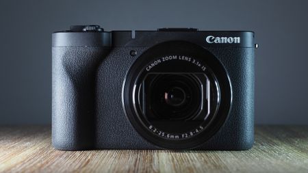 Canon PowerShot V1 on a wooden surface