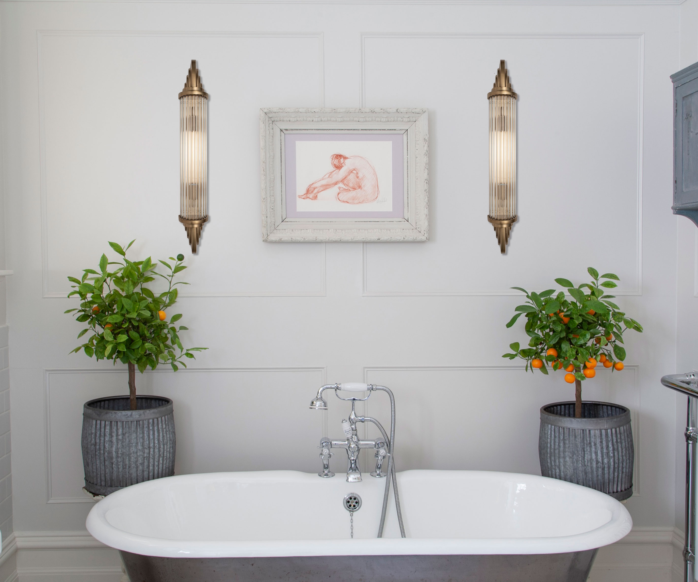 traditional bathroom with wall panelling and glass wall lights and grey rolltop bath