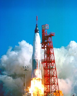 This image shows the launch of Friendship 7, the first American manned orbital space flight. With astronaut John Glenn aboard, the Mercury-Atlas rocket is launched from Pad 14, February 20, 1962.